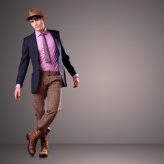 Handsome man posing in the studio - copy space