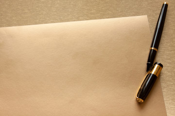 Pen on a golden background