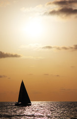 Fototapeta na wymiar Yacth in sunset at the beach