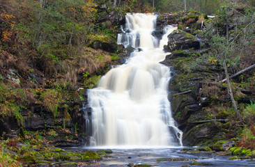 mountain waterfall. fast stream water. autumn landscape