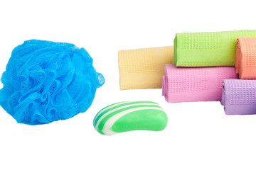 Sponge, soap and towels on a white background..