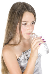 Young girl with glass of water