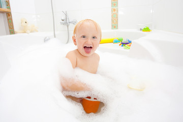 A baby girl in a bathtub