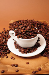 Cup full of coffee beans