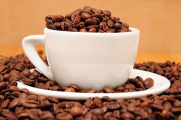 Cup full of coffee beans