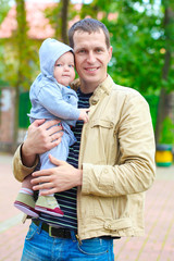 Fototapeta premium Father's love. Cute baby with father.