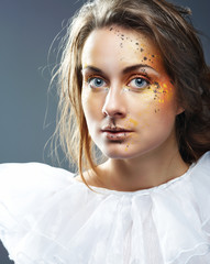 Portrait of beautiful young woman with glamour makeup