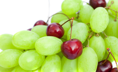 grapes and cherries isolated on white