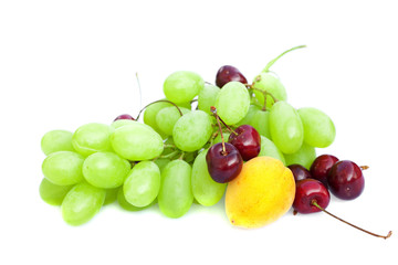 grapes, cherries and apricots isolated on white