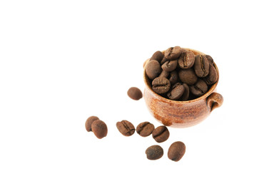 a small pot of coffee beans isolated on white