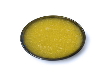 Fresh honey on the black saucer