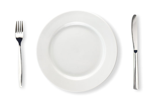 Knife, white plate and fork isolated