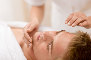 Fototapeta na wymiar Male beauty - man receiving facial massage