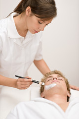 Fototapeta premium Male beauty - man having facial mask