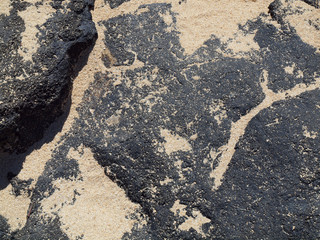 Lava rock with lots of sand on top on Oahu