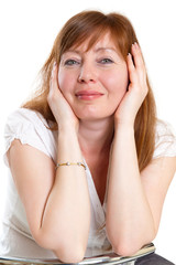 Fototapeta premium red-haired woman sitting in a chair