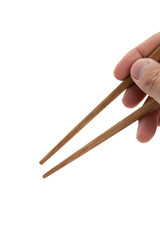 Hand holding a pair of chopsticks