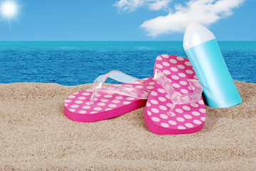 sandals and suntan lotion on a sunny day