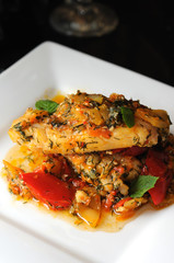 Braised filletted fish with vegetables