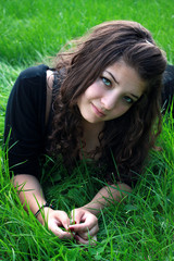 teenager on a green grass.