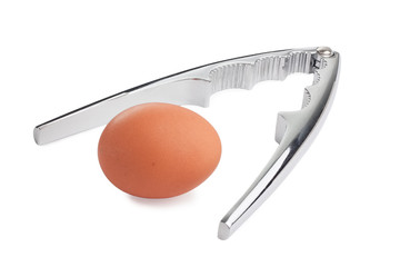 Stainless steel nut cracker with brown egg