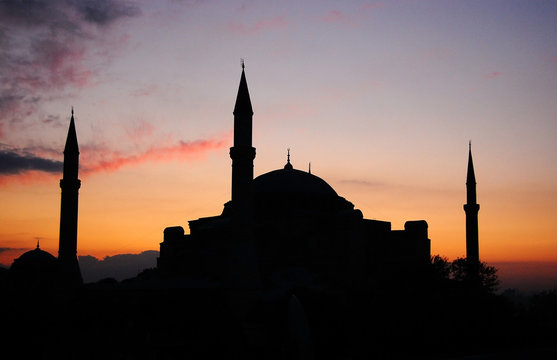 Silhouette during sunrise of a mosque building in Turkey.