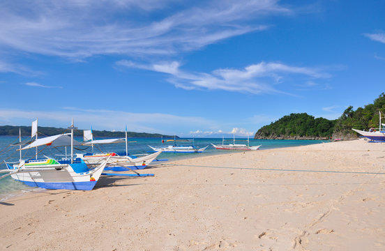 Traditional Paraw Sailing Boat On White Beach