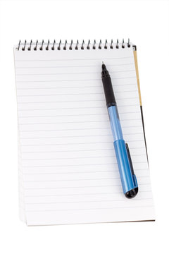 Notepad and pen isolated on white