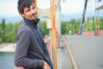 Obraz premium Portrait of a young beautiful man on autumn walk