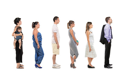 Full length portrait of men and women standing together in a lin