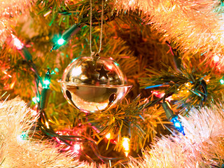 Fototapeta na wymiar Christmas Tree Holiday Ornaments Hanging on a Tree