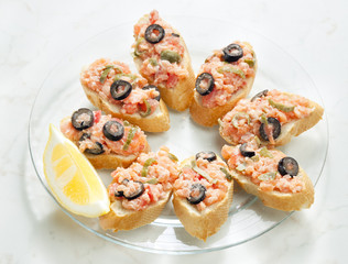 salmon tartare with capers and black olives