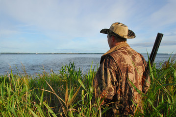 hunter waiting in the reeds