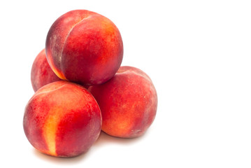 Fototapeta na wymiar Four peaches