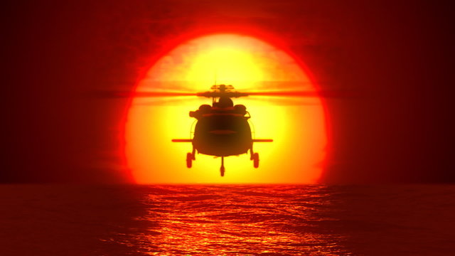 Helicopter flying from the sun over a water