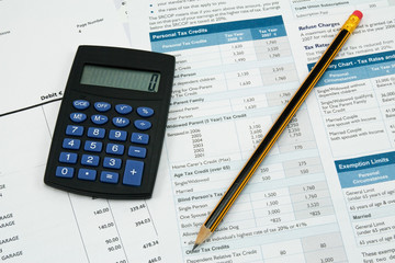 Naklejka na ściany i meble financial accounting. calculator,pencil and tax form