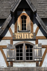 Fototapeta na wymiar Rustic Building with Wine Sign
