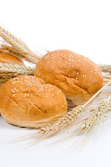 Fresh bread with ears of wheat