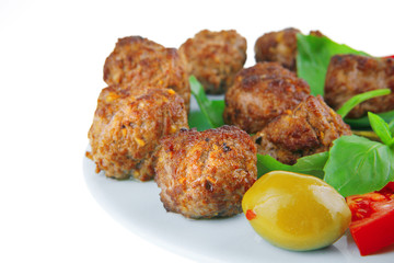 roast meat balls on basil