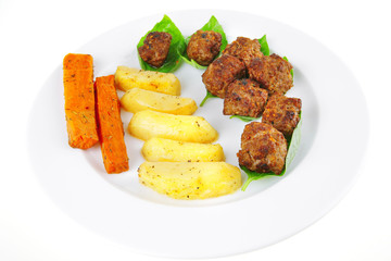 served meatballs on basil leaf