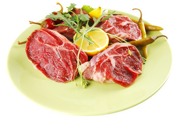 raw beef medallion on green