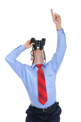 Businessman looking through binoculars