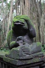 bali stone statue with moos