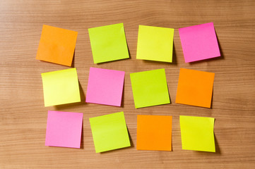 Many reminder notes on the wooden background