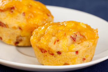 Freshly baked cornbread muffins with cheddar cheese