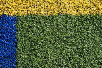 Kunstrasen Rasen Wiese gr&uuml;n Hintergrund gelb blau Linie Sport