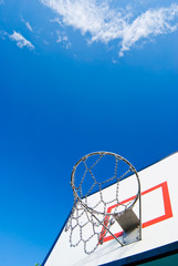 Basketball stands under blue sky