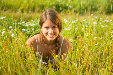 girl  lying in meadow grass