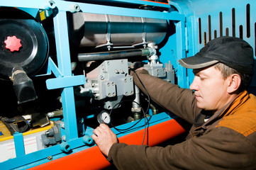 repairman using manometer