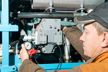 repairman using manometer